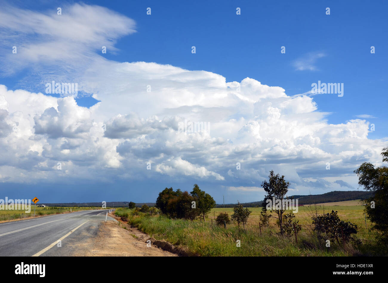 Beautiful cloudscape and storm over road through countryside, New South Wales, Australia Stock Photo