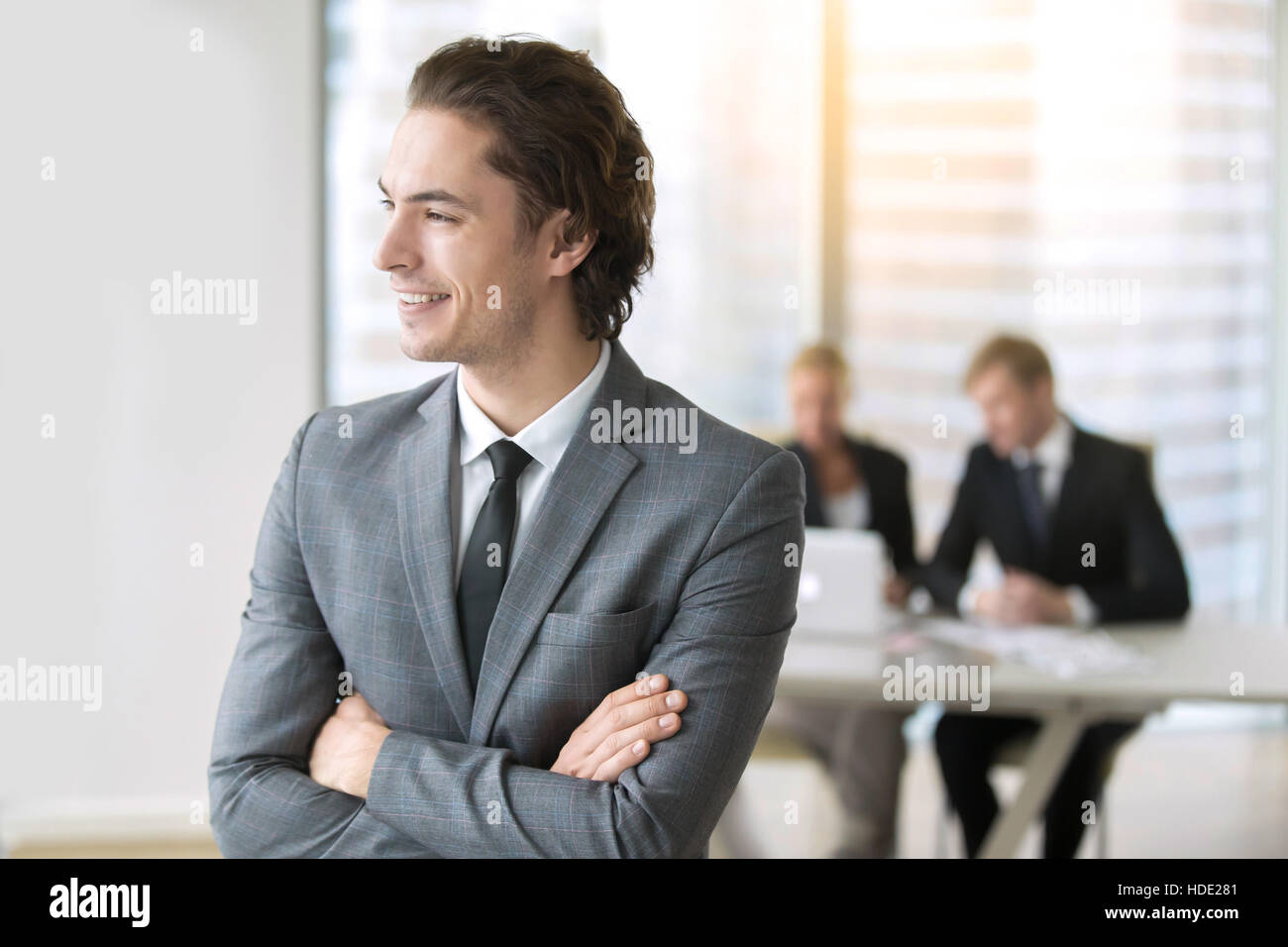 Portrait of a young smiling businessman Stock Photo - Alamy