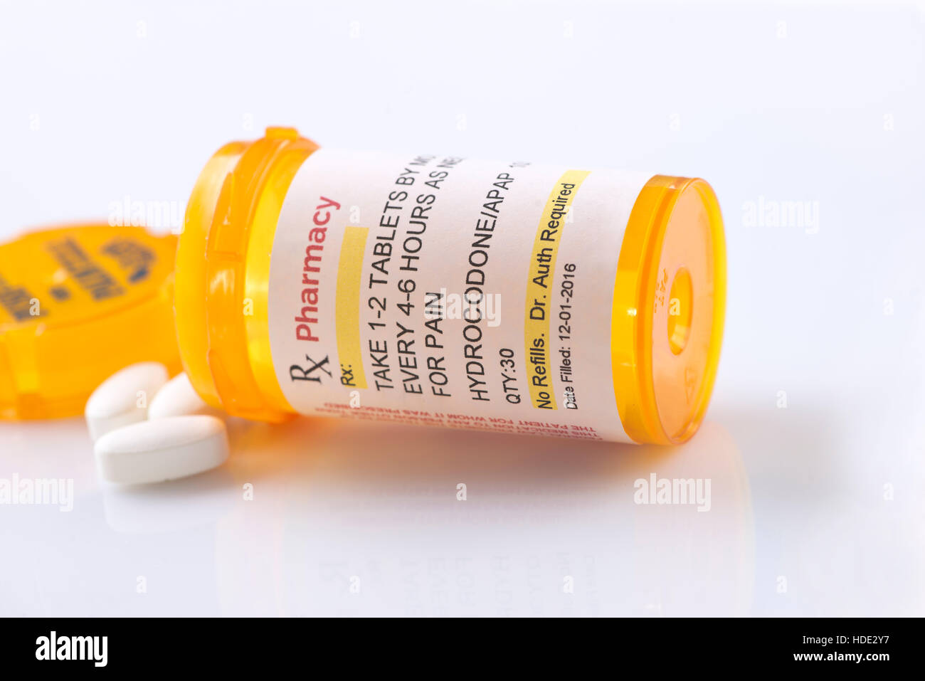 Hydrocodone prescription bottle.  Hydrocodone is a generic medication name and label was created by photographer. Stock Photo