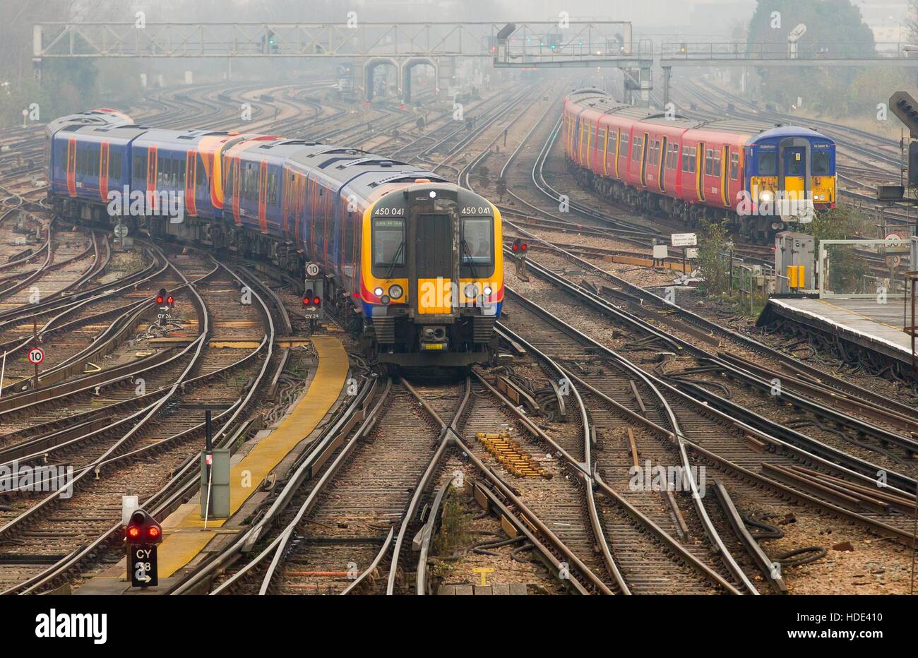 A South West Trains Class 450 train passes through Clapham Junction station in South West London. 450041 Stock Photo