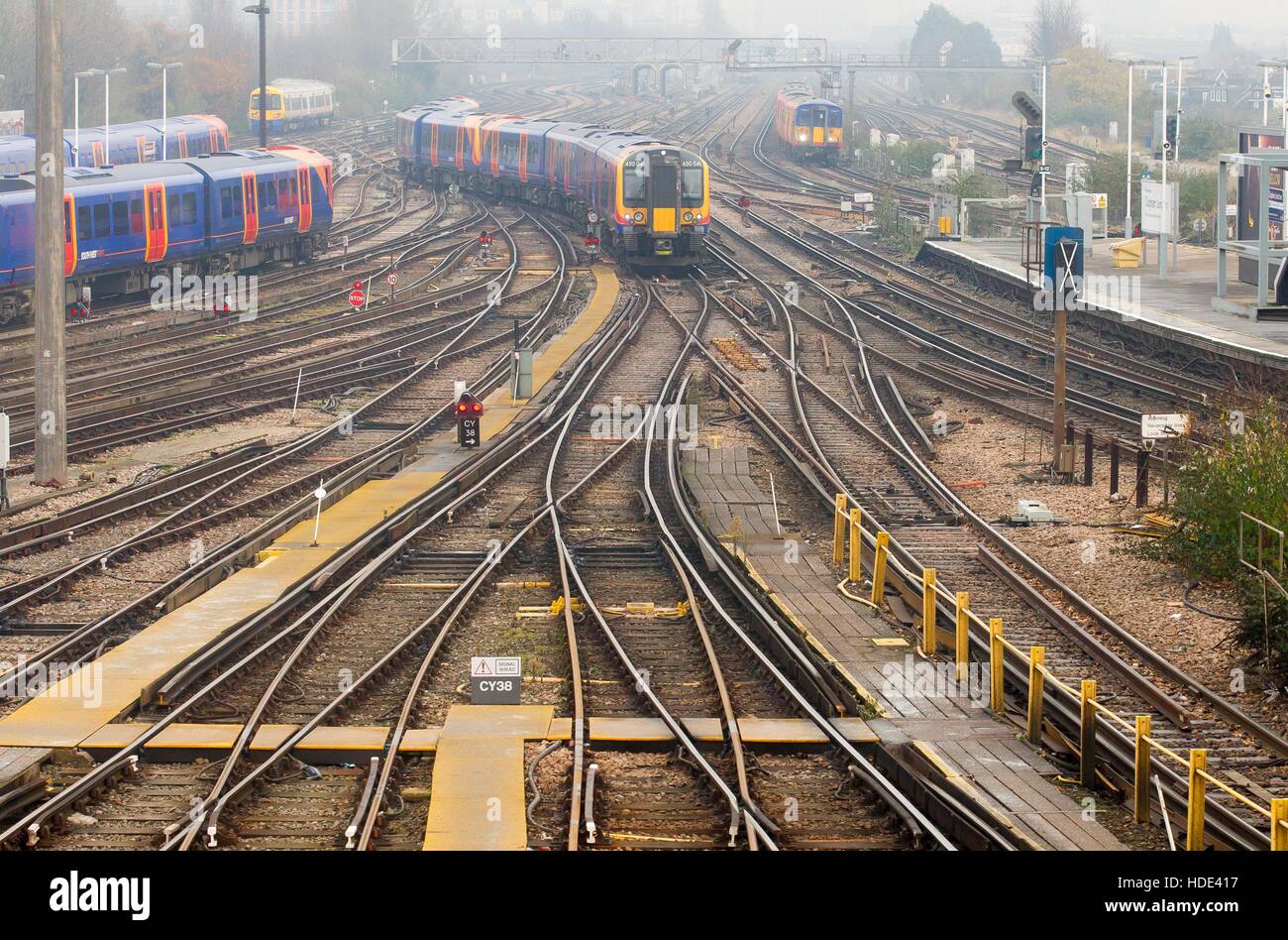 A South West Trains Class 450 train passes through Clapham Junction station in South West London. 450041 Stock Photo