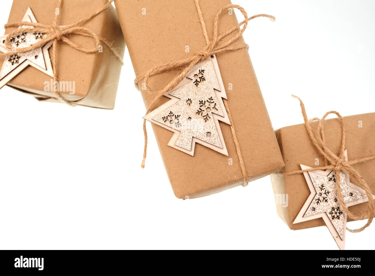 gift boxes tied with a rope wooden stars on white background Stock ...