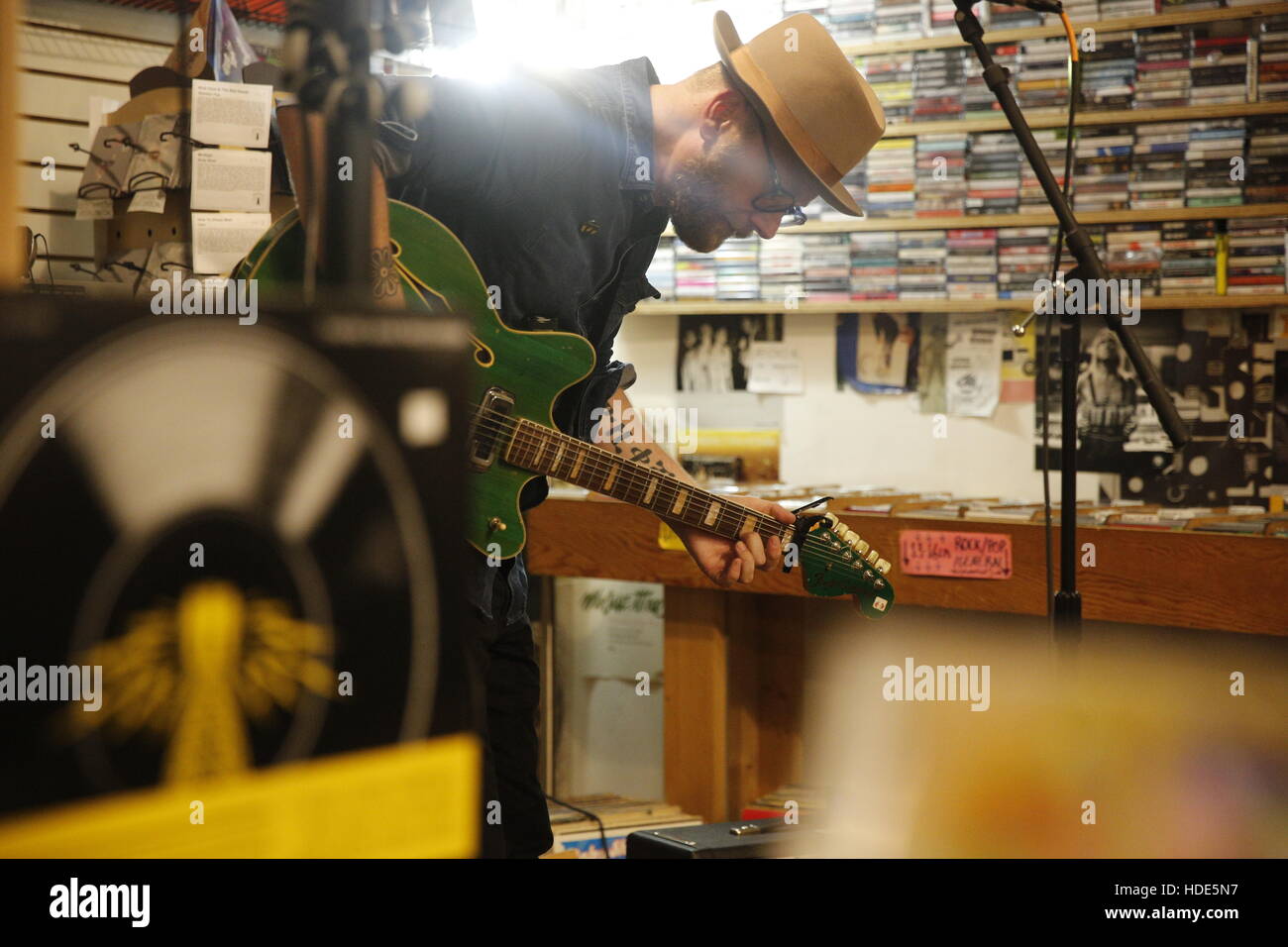 Mike Doughty performs at Landlocked Music in Bloomington. Doughty was in the band, 'Soul Coughing,' during the 1990s and recently release a solo record titled, 'The Heart Watches While The Brain Burns.' (Photo by Jeremy Hogan) Stock Photo