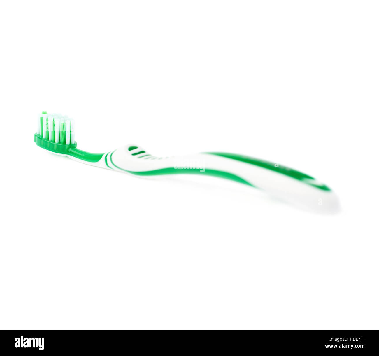 Green toothbrush isolated over white background Stock Photo - Alamy