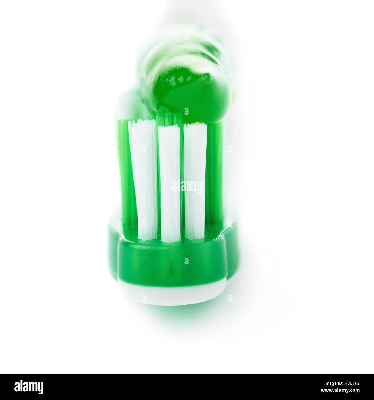 Green toothbrush with paste isolated over white background Stock Photo ...