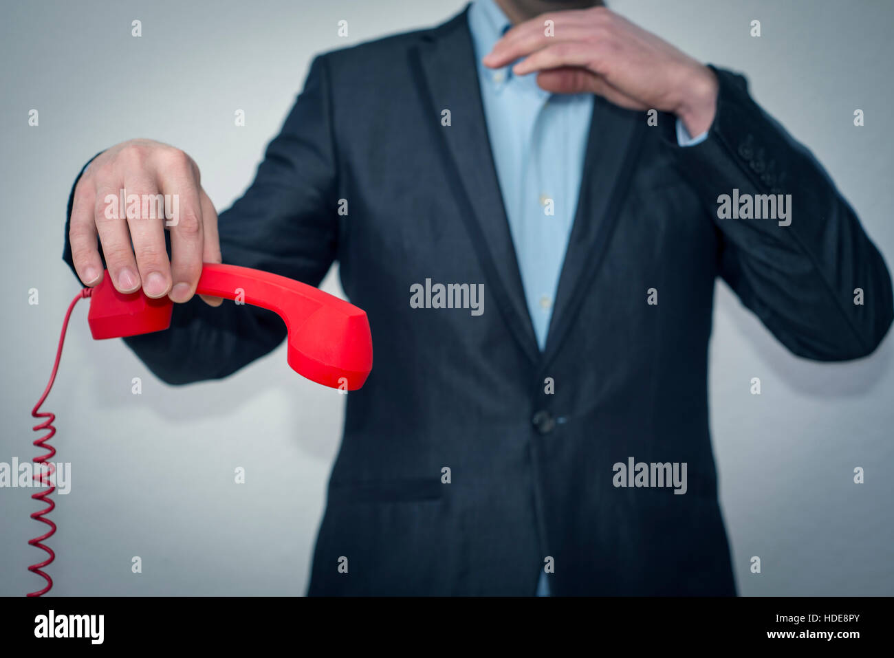 Angry businessman willing to hangup the phone after conversation Stock