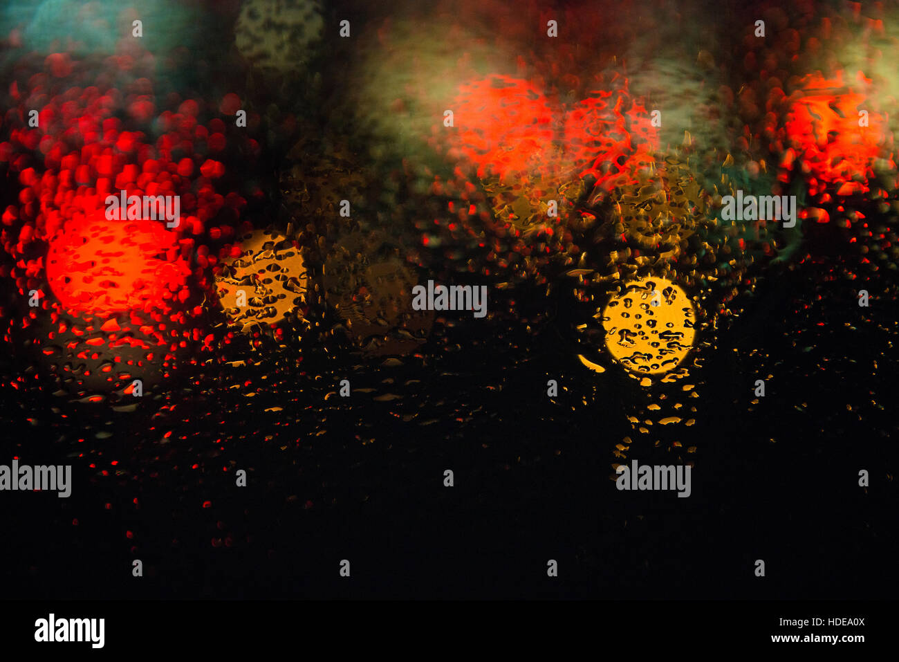 Rain drops on window with street bokeh lights Stock Photo - Alamy