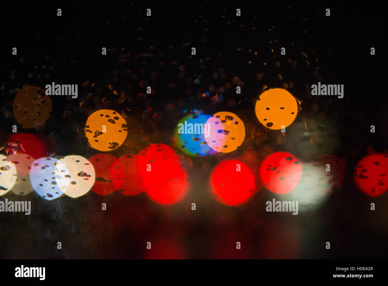 Rain drops on window with street bokeh lights Stock Photo - Alamy