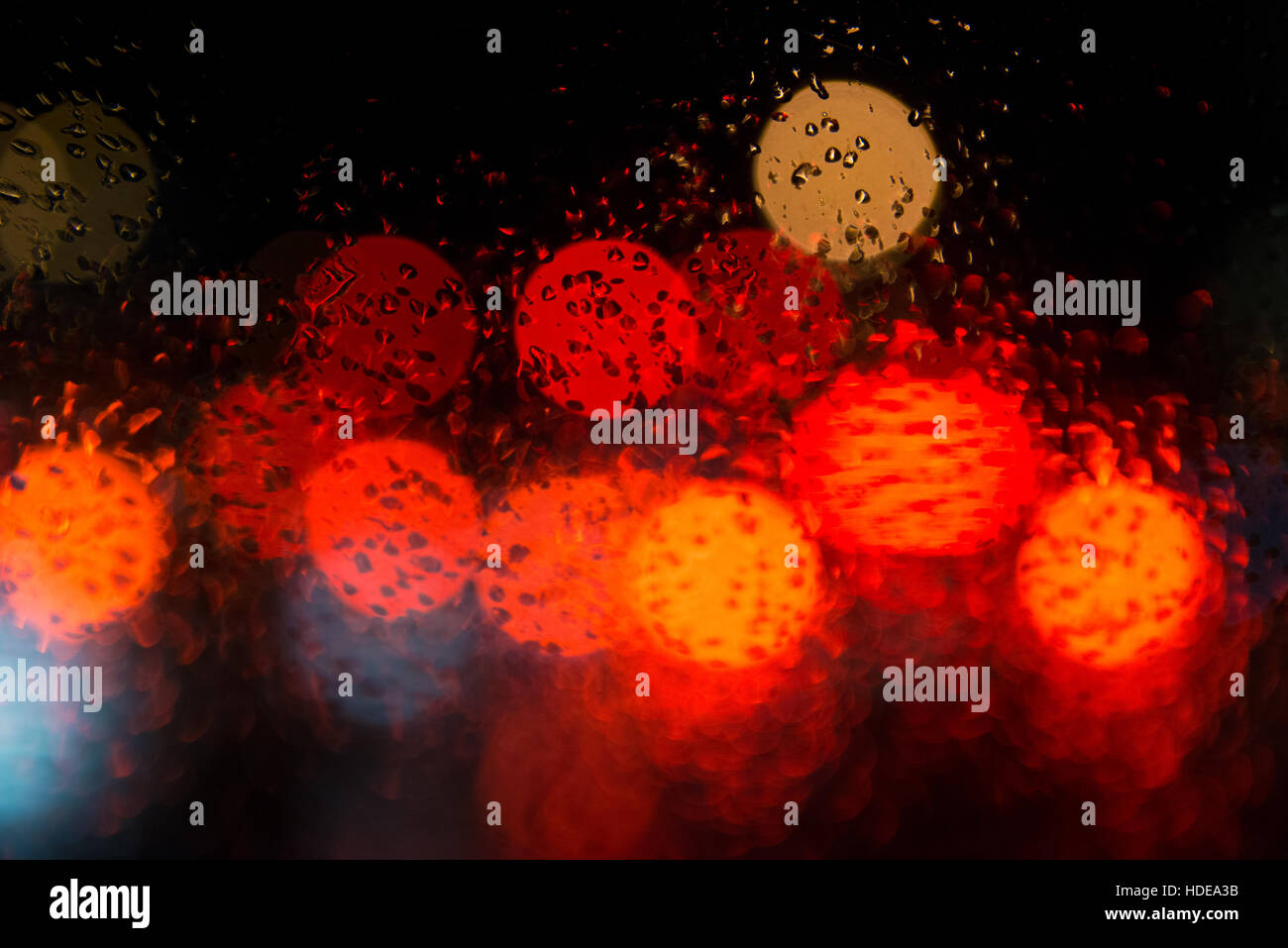 Rain drops on window with street bokeh lights Stock Photo - Alamy
