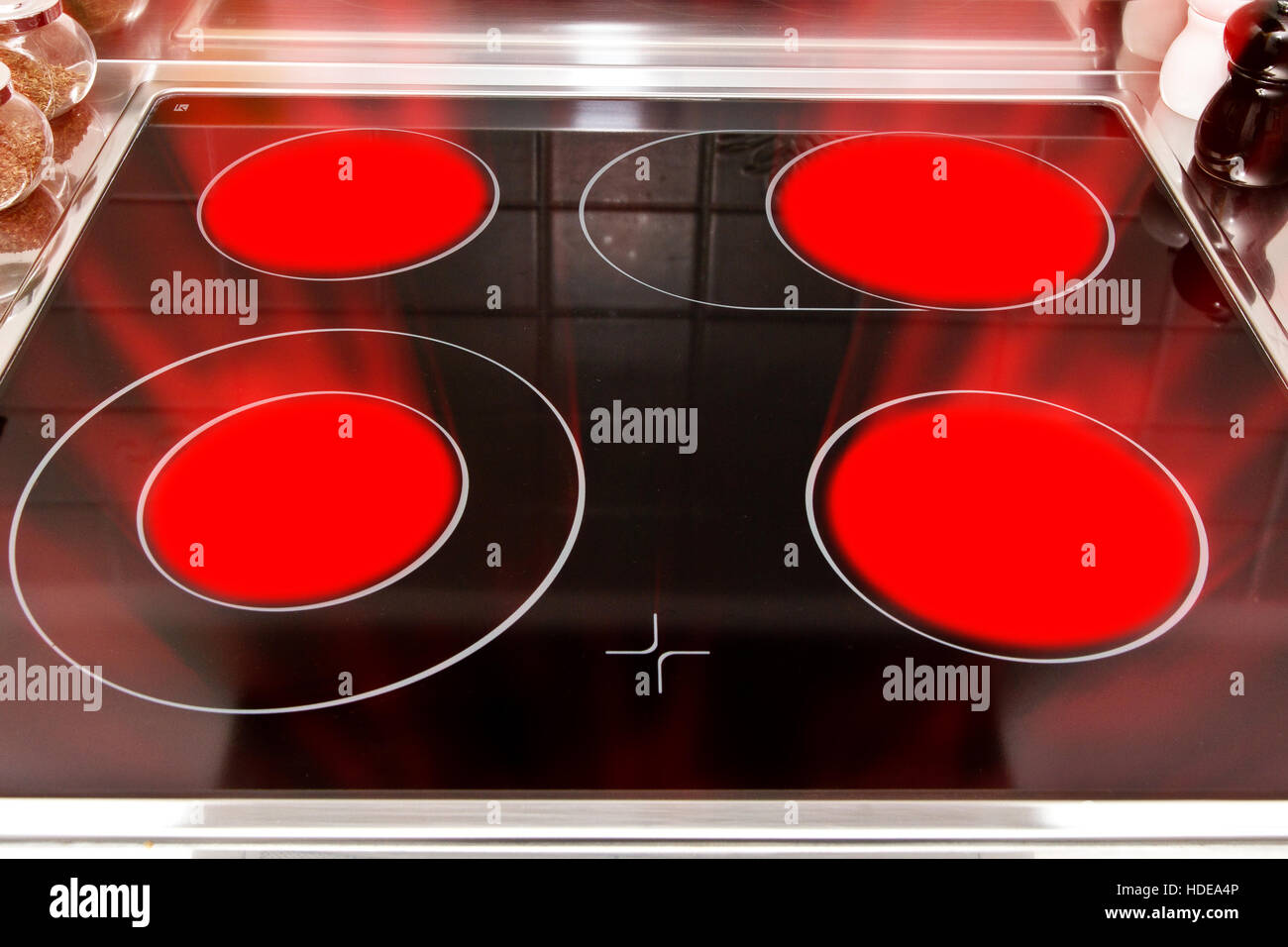 https://c8.alamy.com/comp/HDEA4P/ceramic-stove-top-with-glowing-plates-HDEA4P.jpg