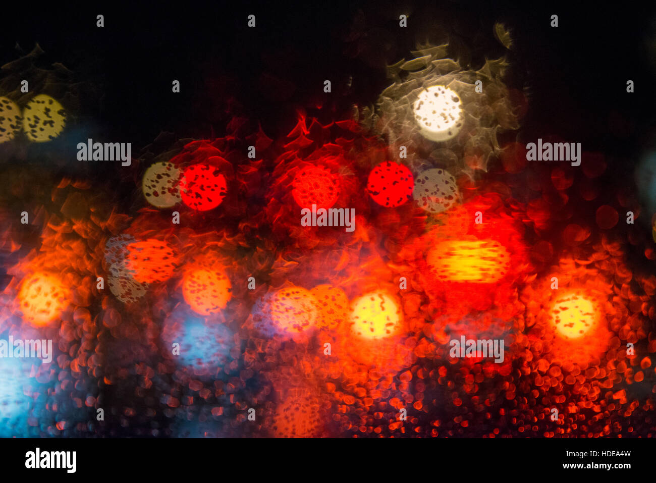 Rain drops on window with street bokeh lights Stock Photo - Alamy