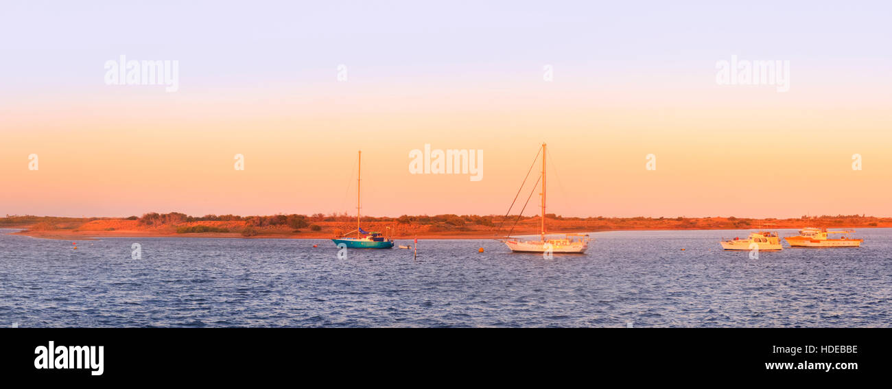 Yachts moored in an inlet between Carnarvon town centre and Whitlock Island.  Carnarvon, Western Australia Stock Photo