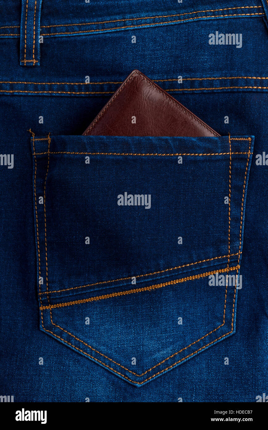 men's wallet in the back pocket of jeans close-up Stock Photo