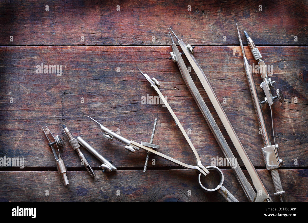 Set of vintage drawing instrument on old wooden background Stock Photo