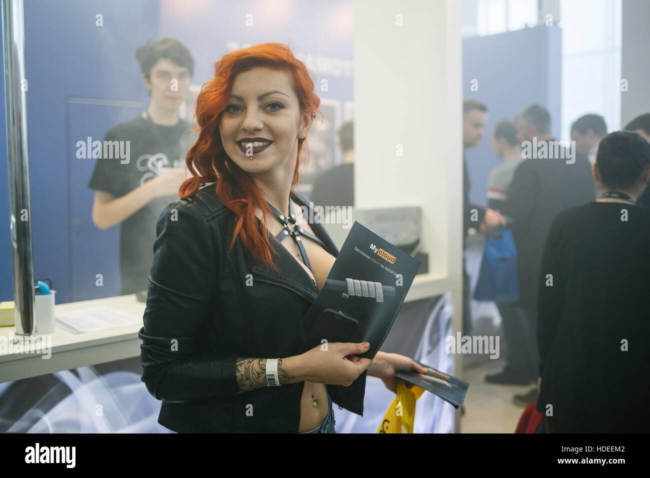 MOSCOW - 9 DECEMBER,2016: International Vape Expo.People at big vaping exposition.Visitor come to see new vaping devices,vaper liquid on sale Stock Photo