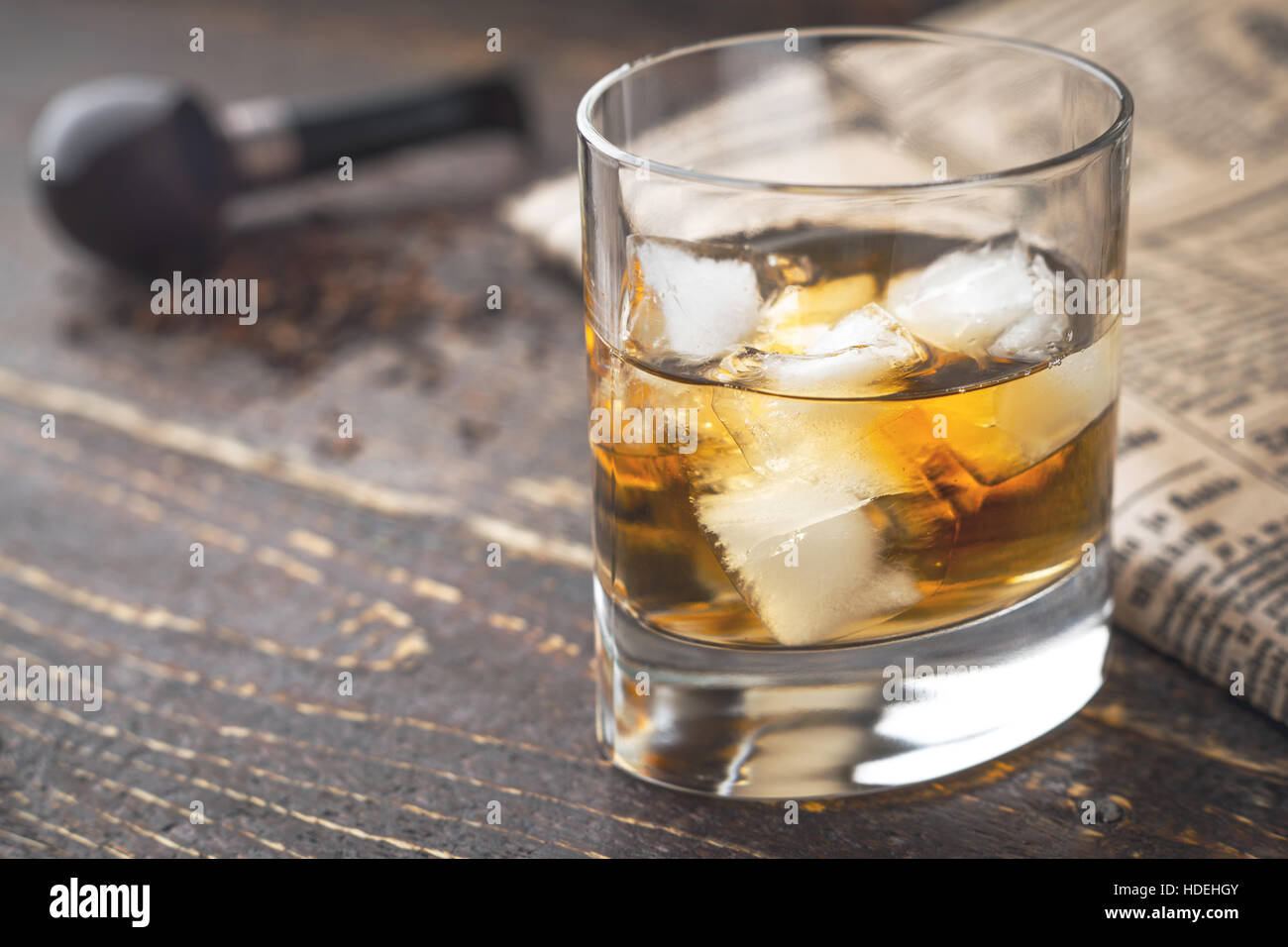 Whiskey with ice on the wooden table Stock Photo