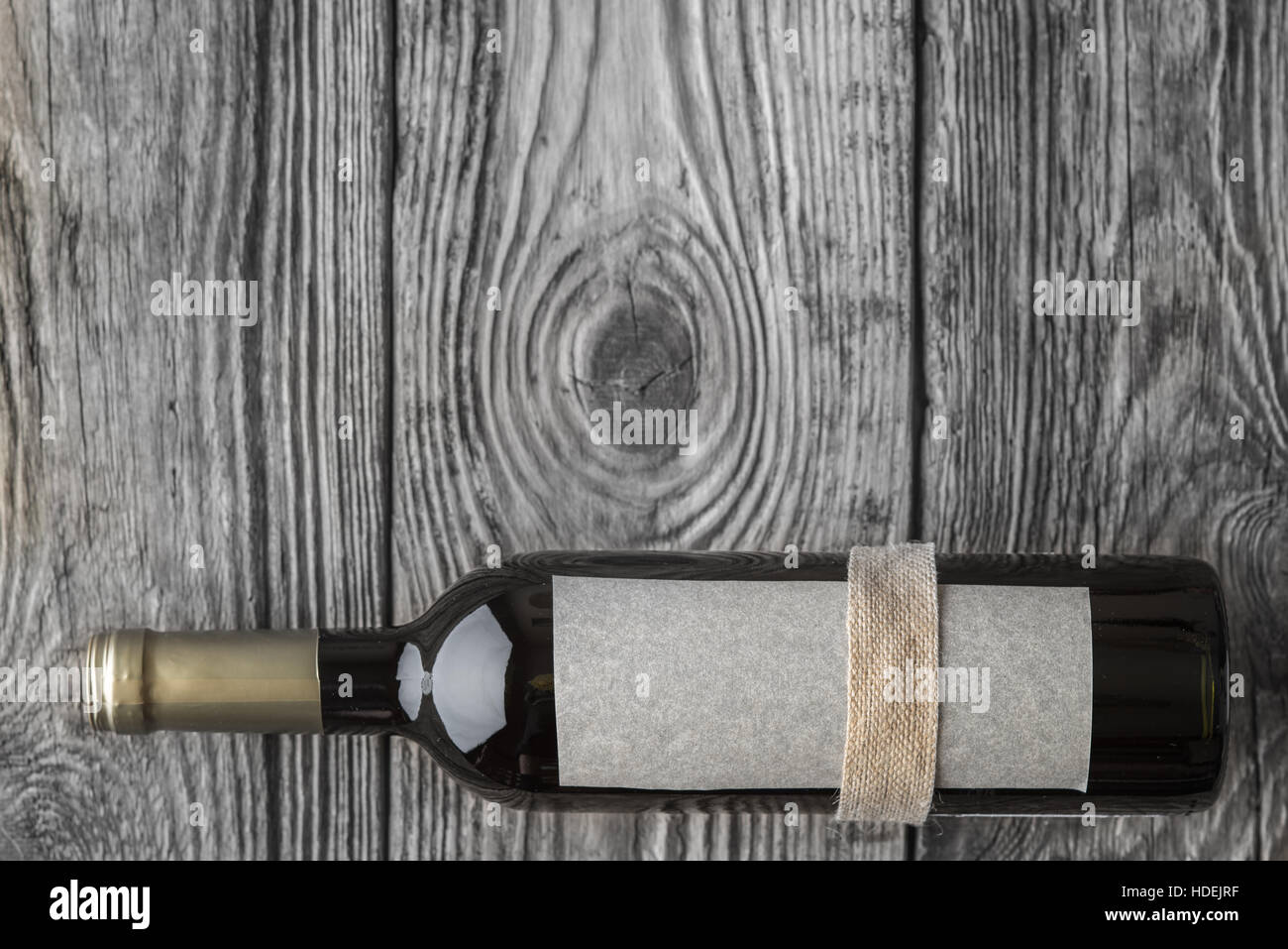 Bottle of wine on the wooden table top view Stock Photo