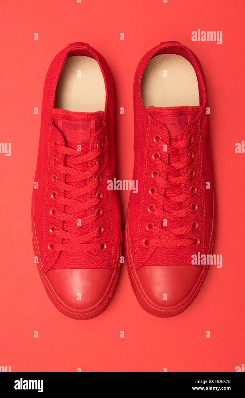 Red sneakers on a blue background Stock Photo