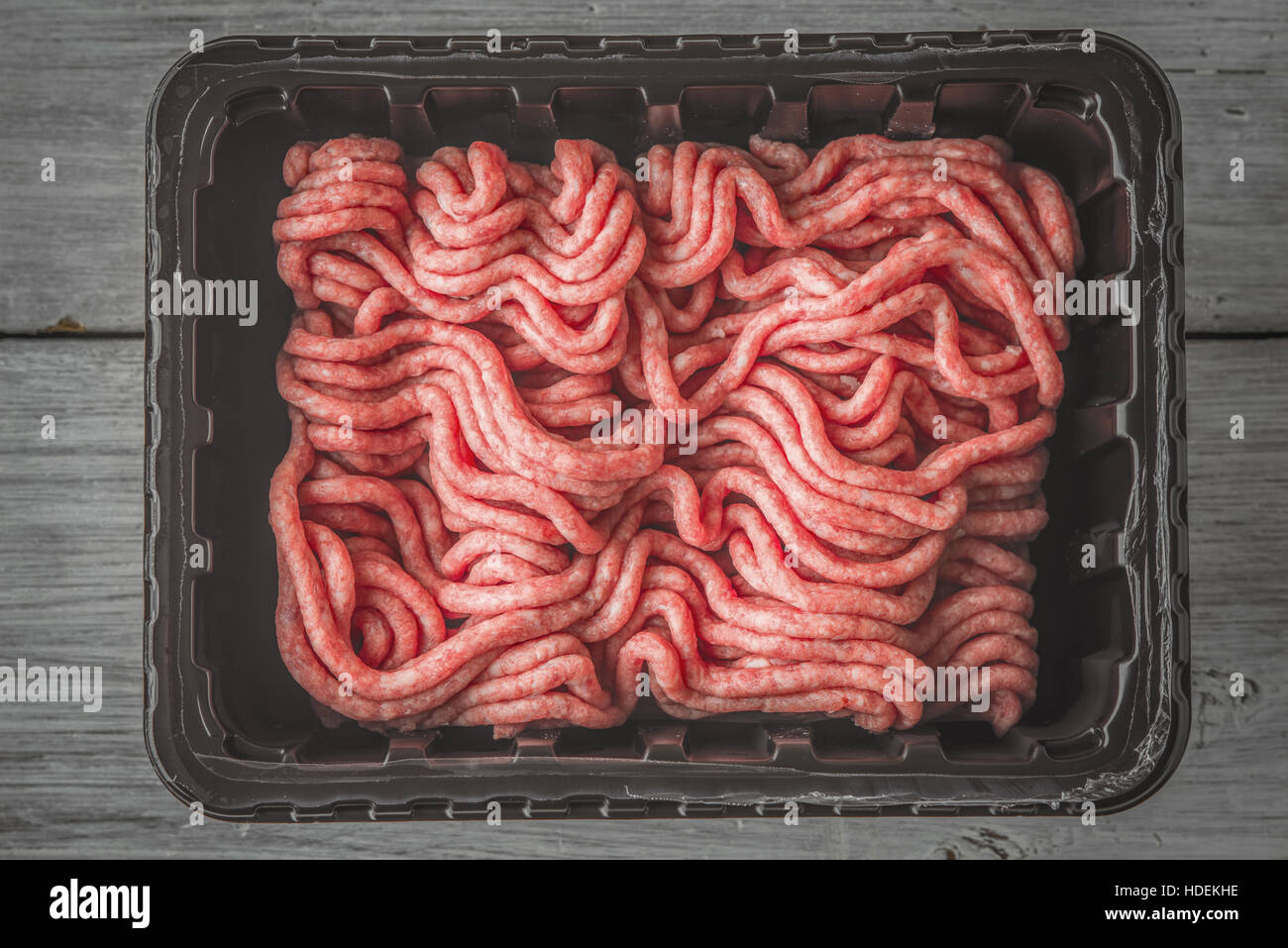 Raw mincemeat in the plastic box top view Stock Photo