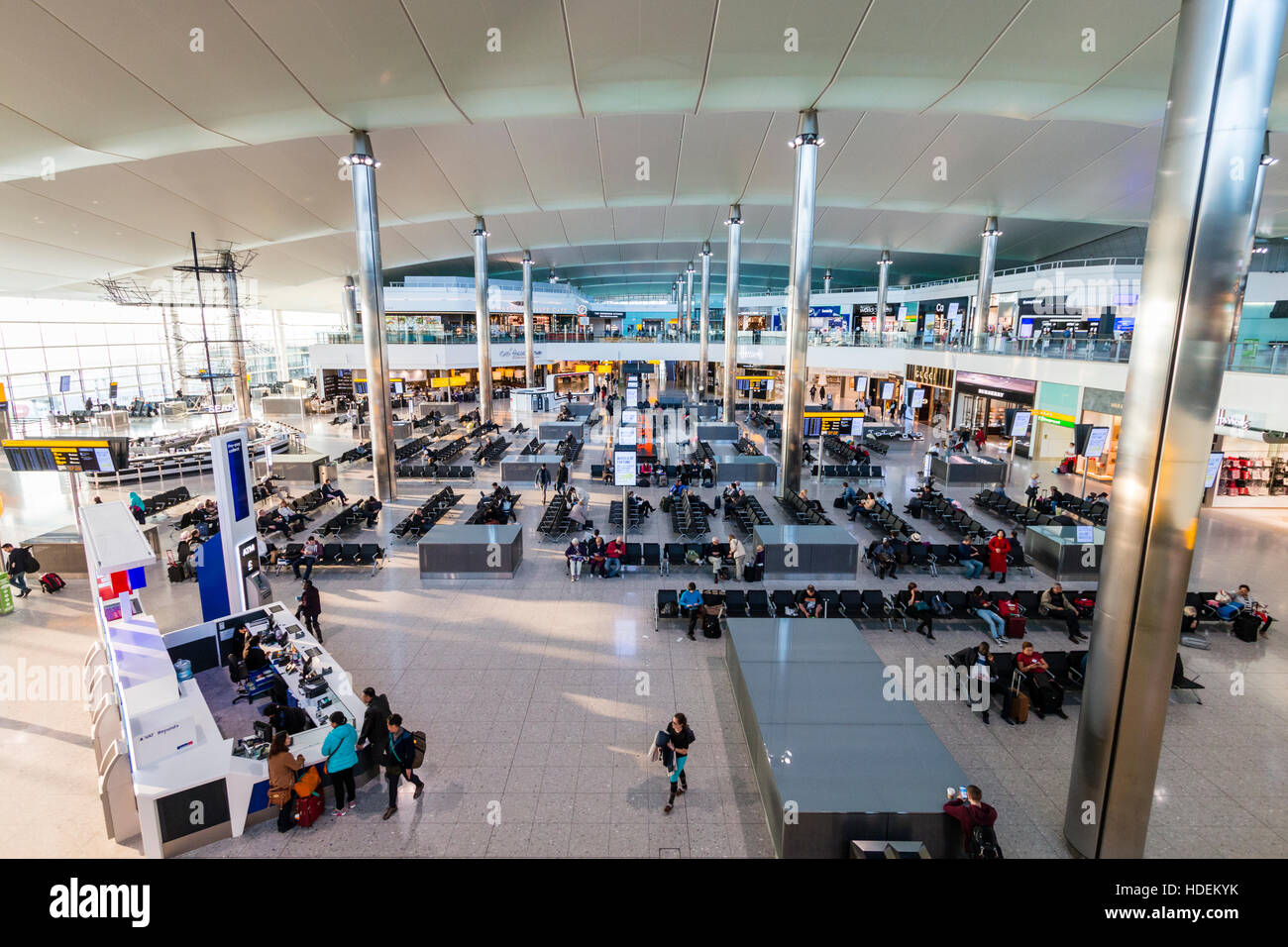 London, Heathrow airport, Terminal 2. Departure lounge interior. Overhead wide angle view of main seating area, not very busy, daytime. Stock Photo