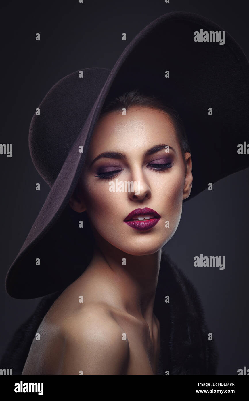 Beautiful girl in fur coat and hat Stock Photo Alamy