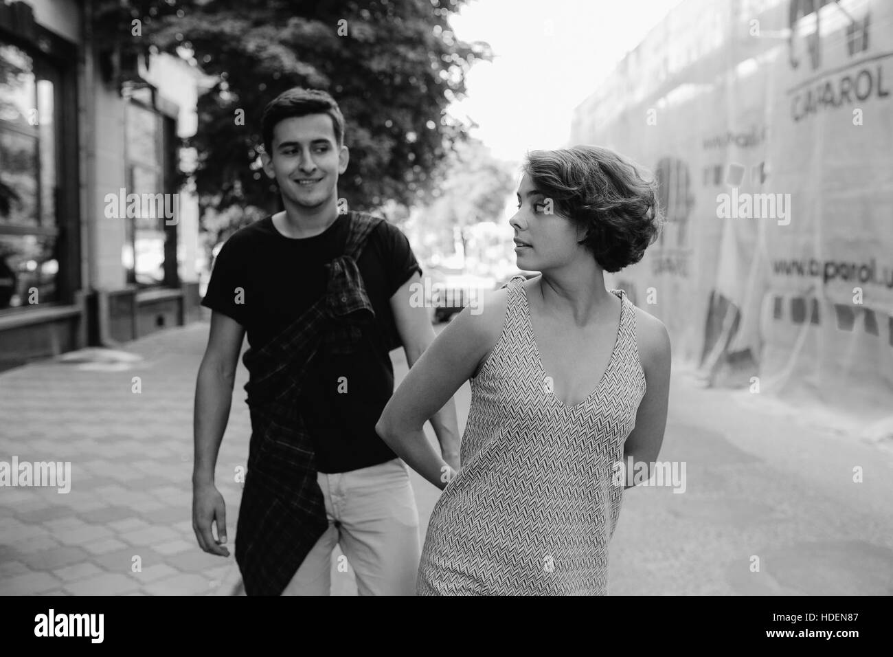 couple walking on the street holding hands Stock Photo - Alamy