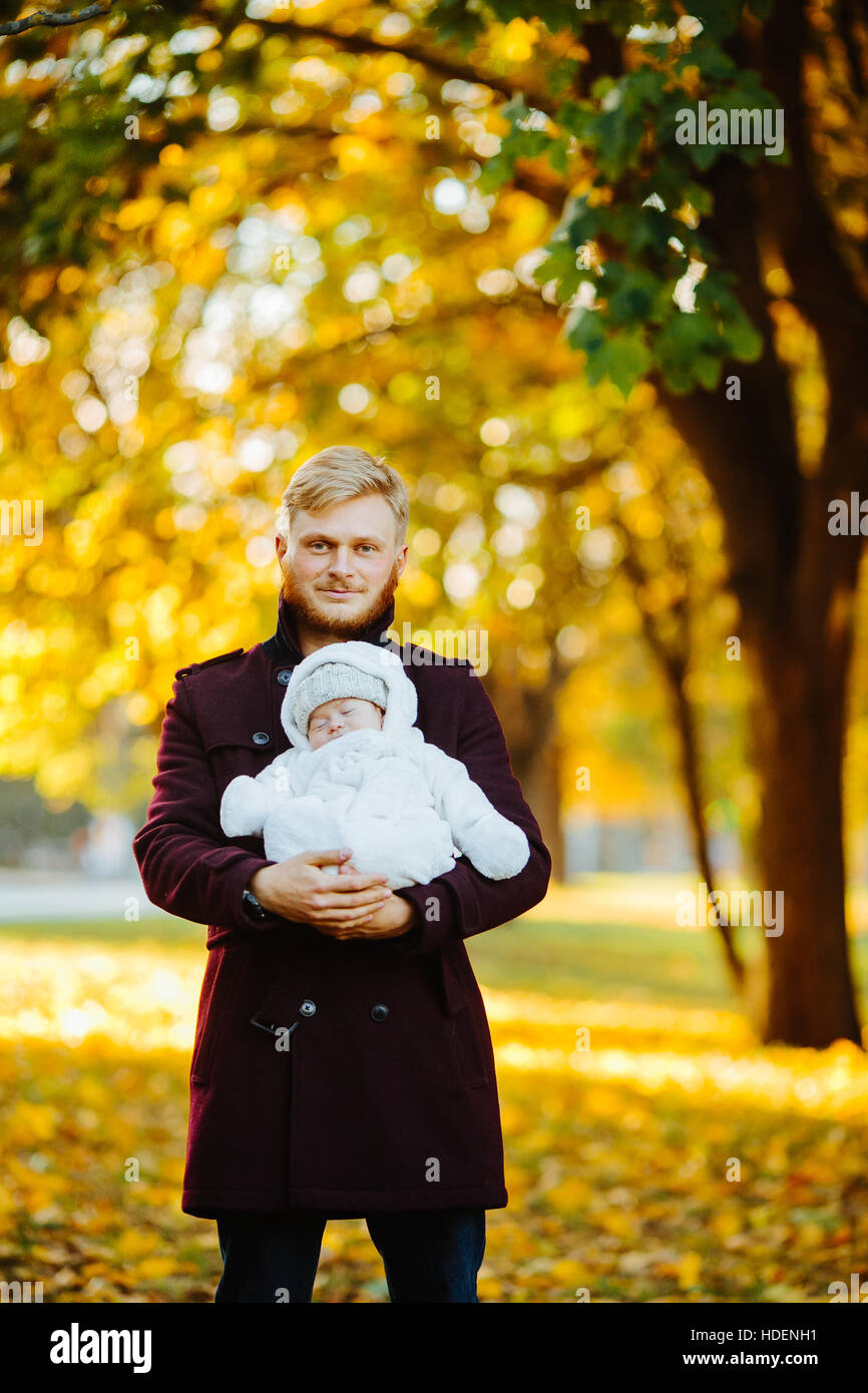 dad and newborn son in autumn park Stock Photo - Alamy