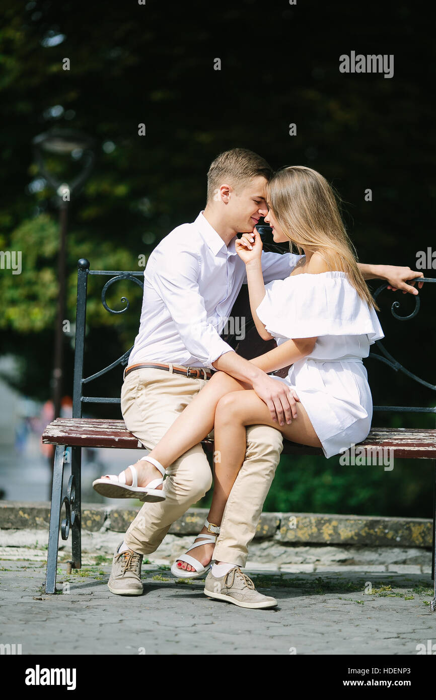 man and woman on a bench in the park Stock Photo - Alamy