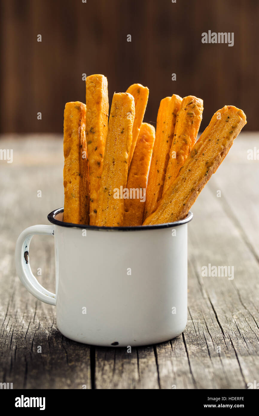 Crispy bread sticks in old cup Stock Photo Alamy