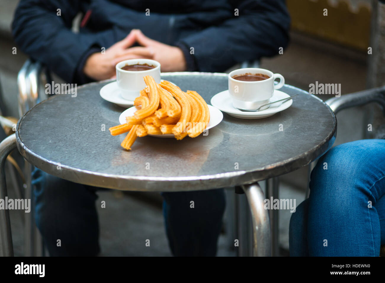 Churros with chocolate, a typical Spanish sweet snack. Madrid. Stock Photo