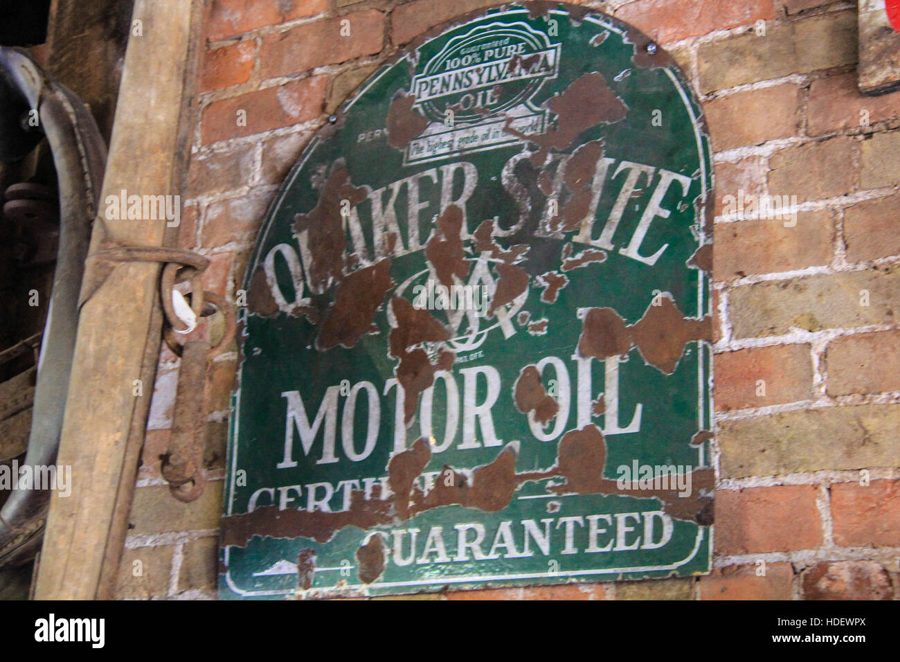 Vintage Quaker State Motor Oil Sign on the brick wall of blacksmith shop in Eden, Utah Stock Photo