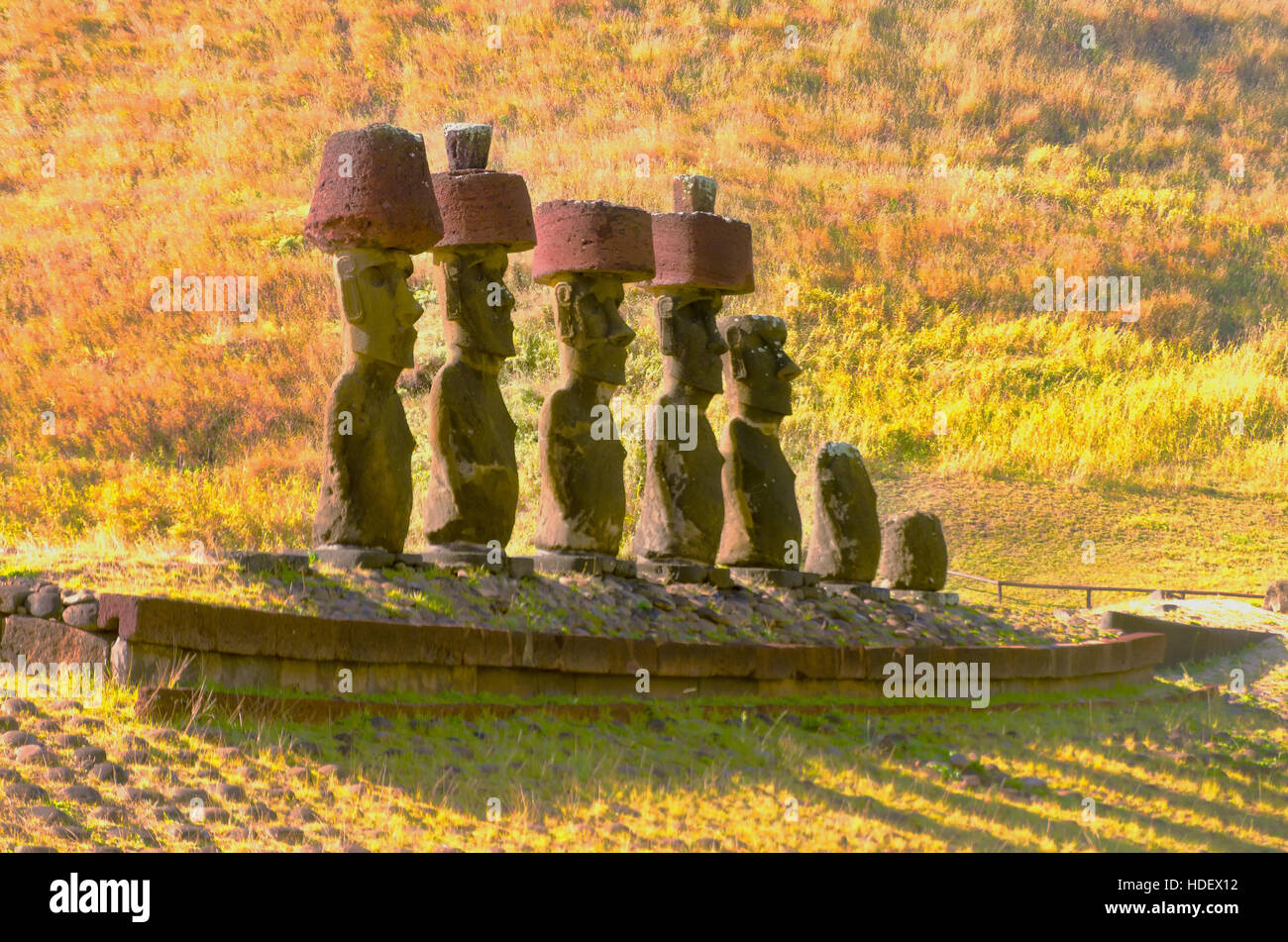 Moai statues wear Pukaos at Anakena Beach on Easter Island in Chile