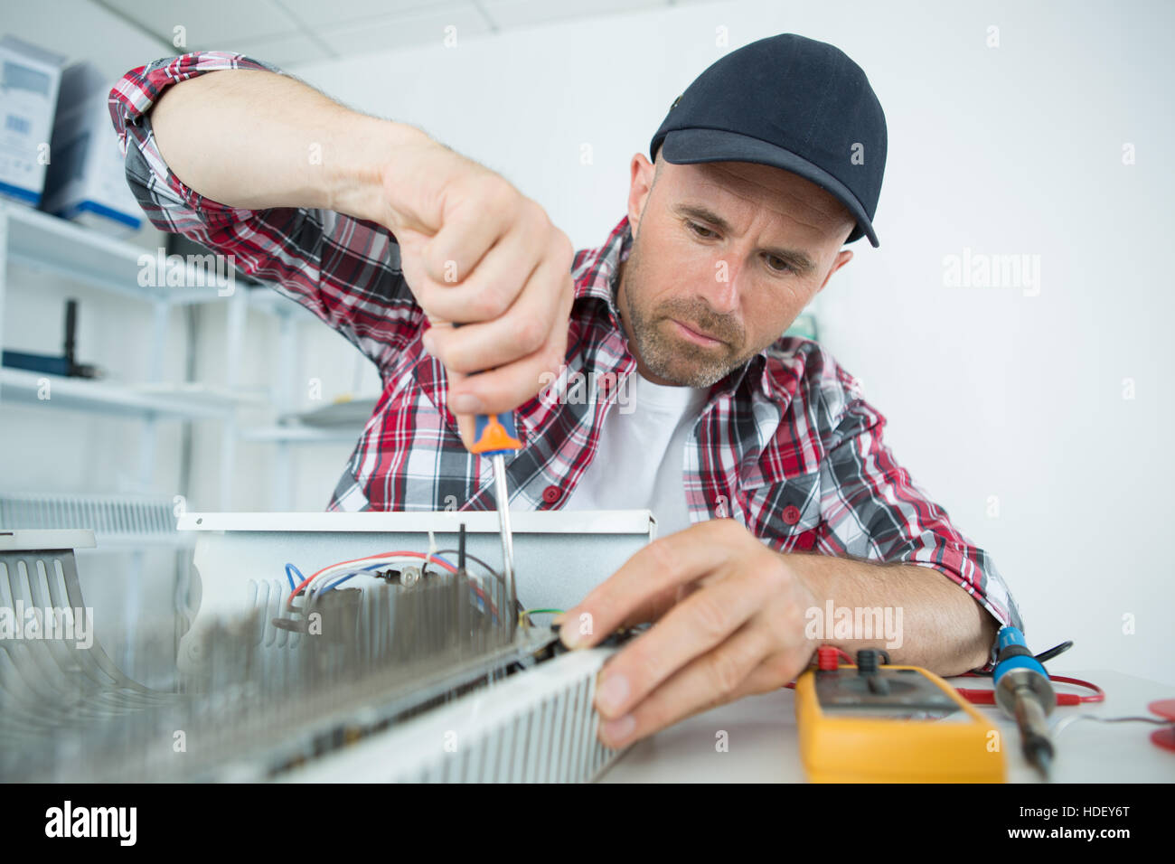 Electrician using screwdriver Stock Photo Alamy