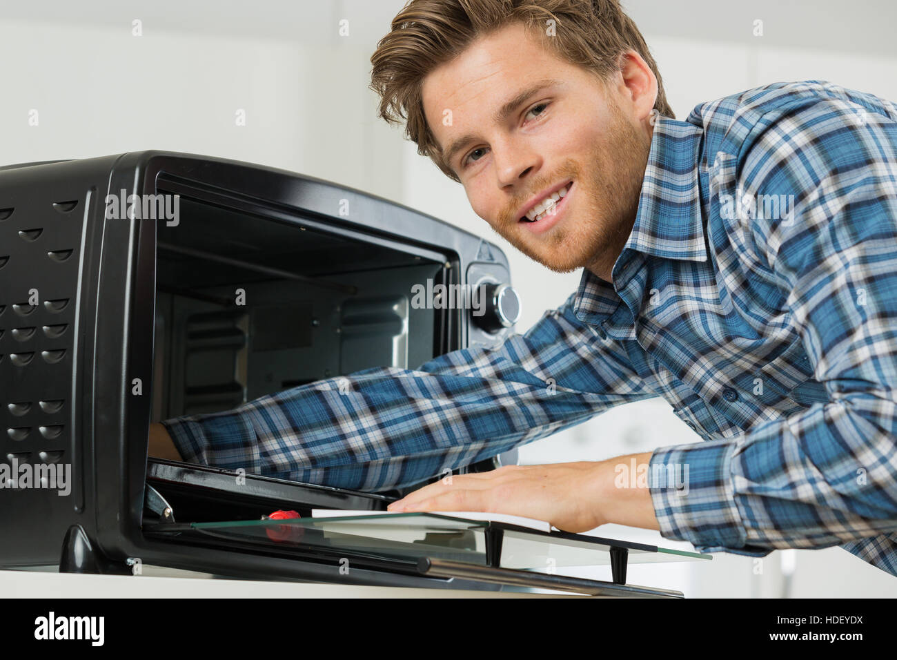fixing an oven toaster Stock Photo