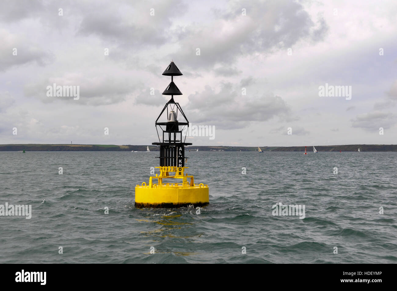 Al Khor Northerly Cardinal buoy with yachts sailing and Dale in the background on a calm autumnal day. Stock Photo