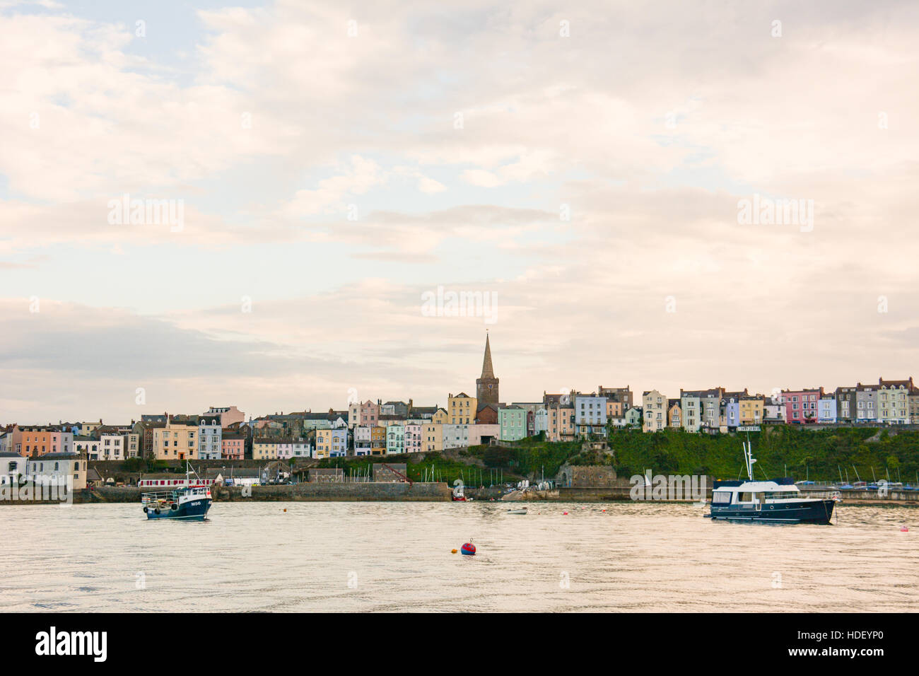 Tenby lit up by a sunset on a calm summers evening. Stock Photo