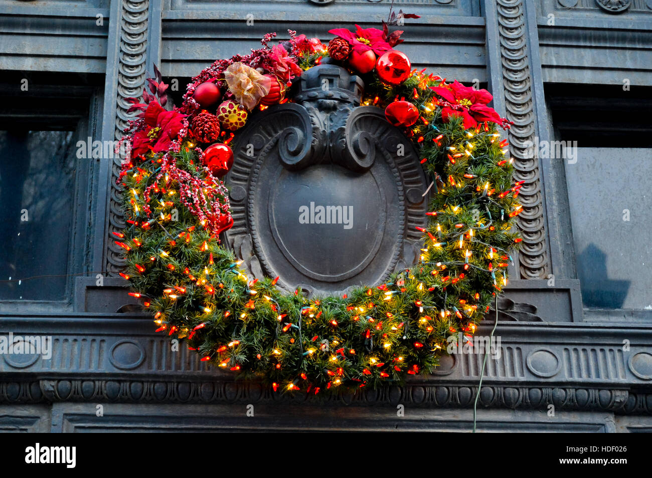 Christmas decorative wreath hanging on the door of the old building in the old port of Montreal Stock Photo