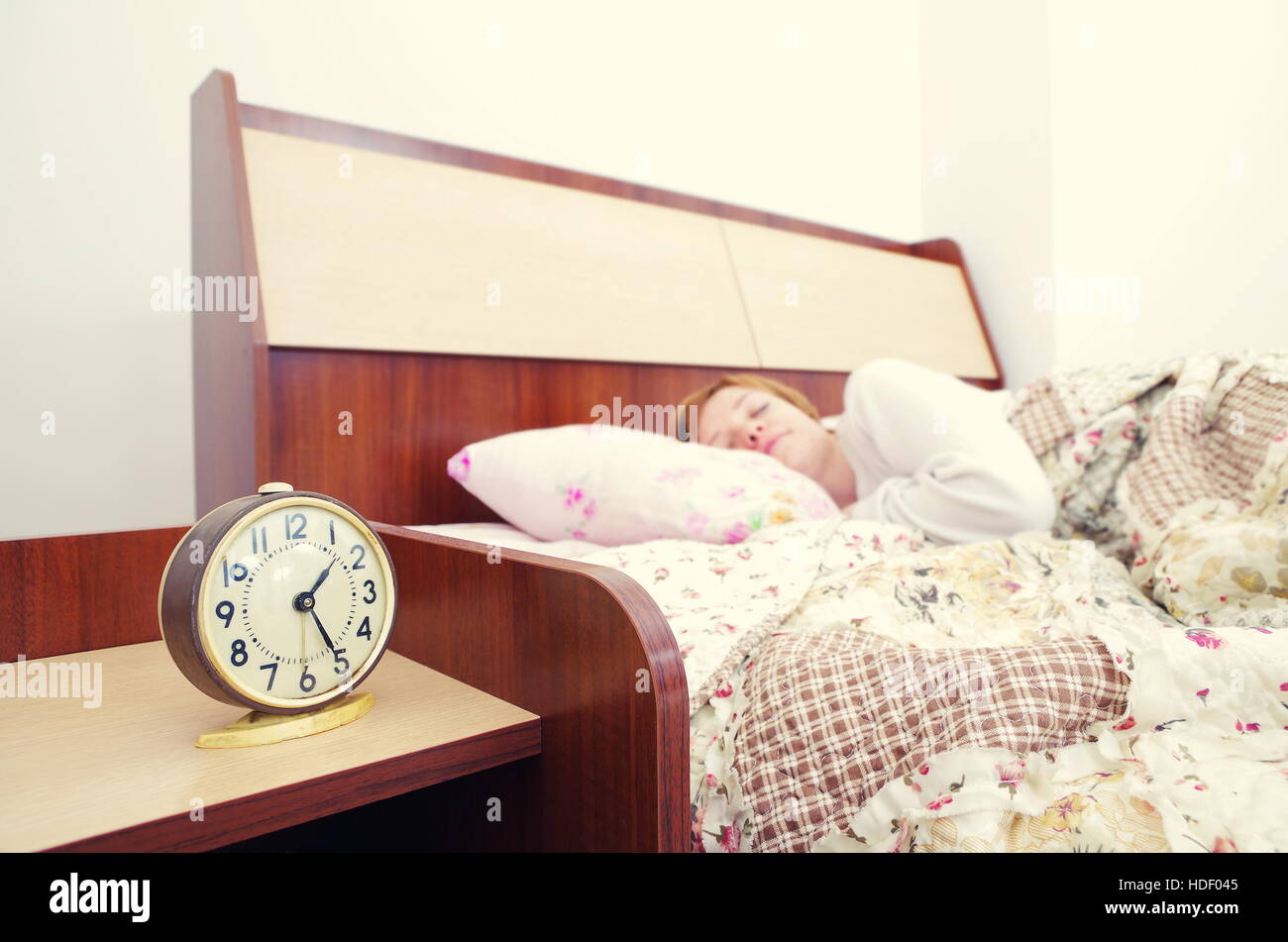 woman and alarm clock in the bedroom Stock Photo Alamy