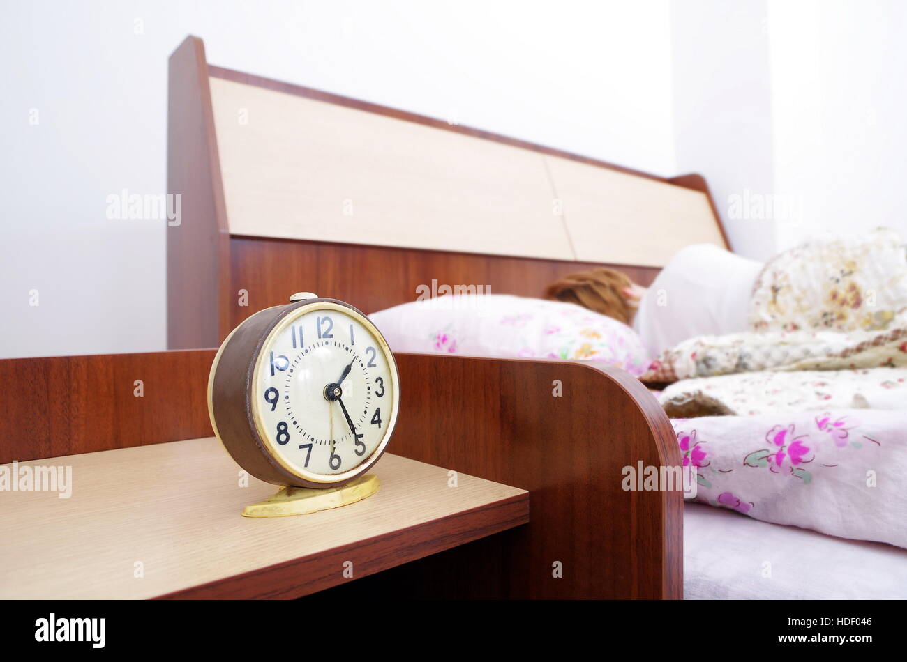 woman and alarm clock in the bedroom Stock Photo Alamy