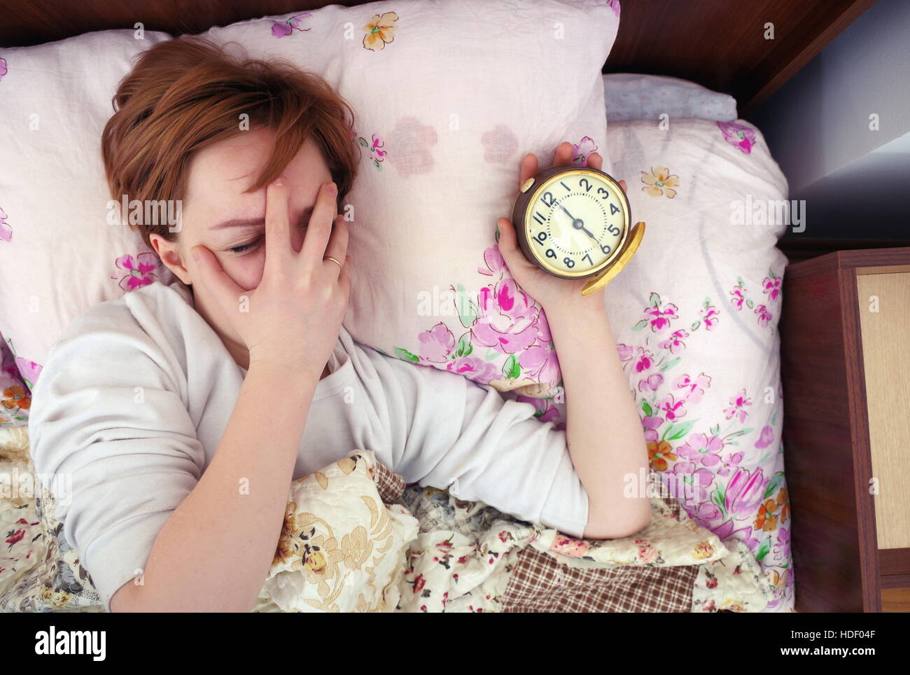woman and alarm clock in the bedroom Stock Photo Alamy