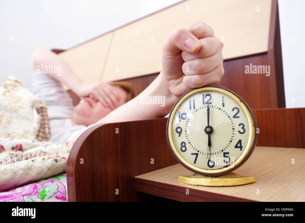 woman and alarm clock in the bedroom Stock Photo Alamy