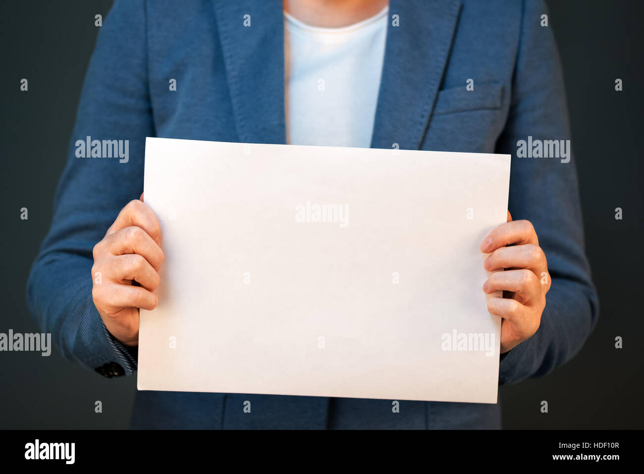 Business woman holding blank document paper as copy space Stock Photo