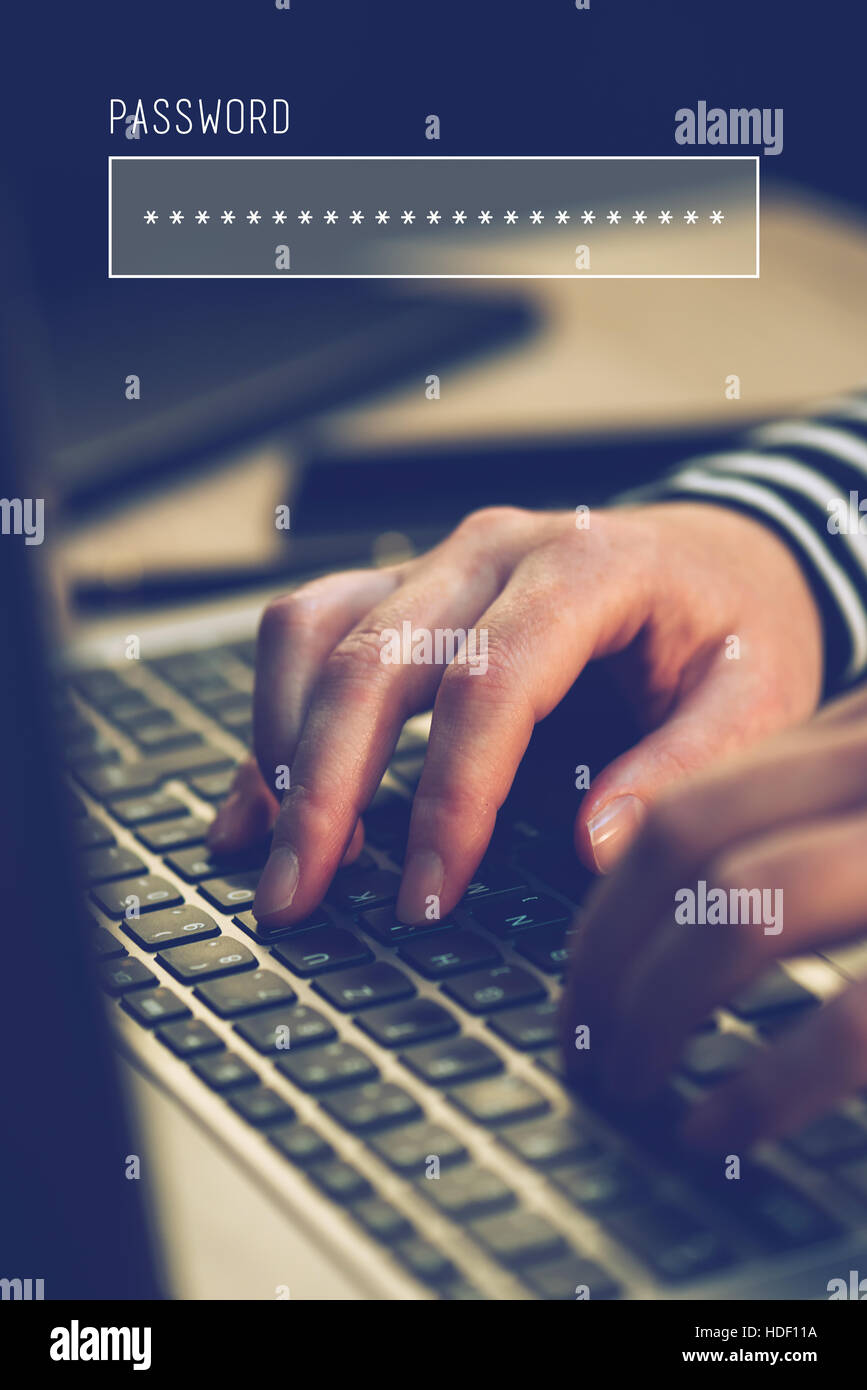 Password box in internet browser, online security with female hands typing on laptop computer keyboard  in office Stock Photo