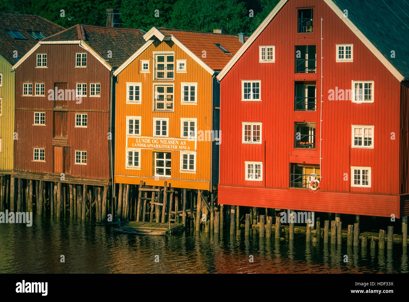 Traditional colourful wooden houses built on water in Trondheim in