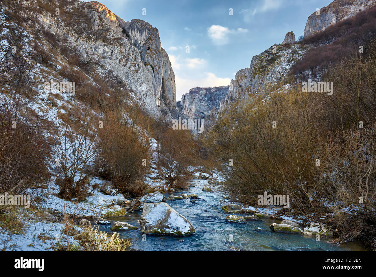 Winter landscape with a river in a mountain pass Stock Photo - Alamy