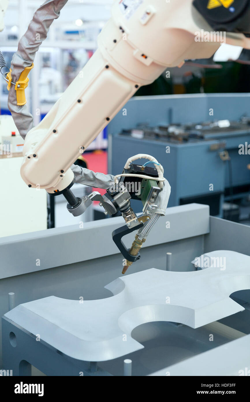 Industrial welding robotic arm Stock Photo