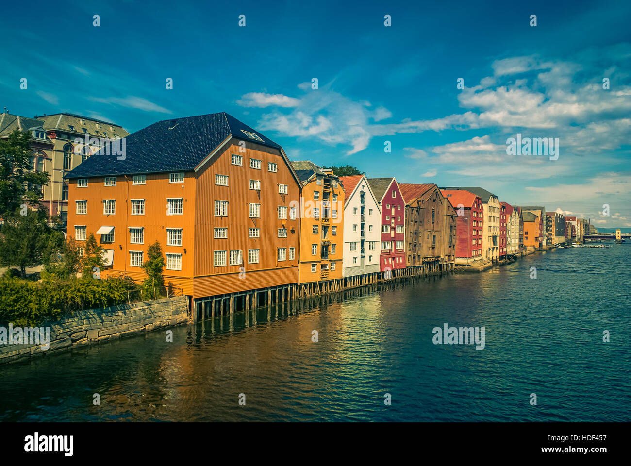 Photo of row of traditional colourful houses built on water in