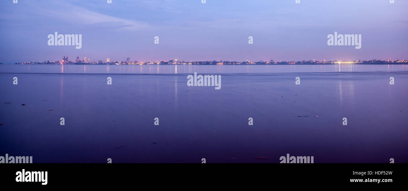 Kinshasa skyline. Photo taken from Brazzaville across Congo river at sunset. Panoramic photo suitable for travel web sites. Stock Photo
