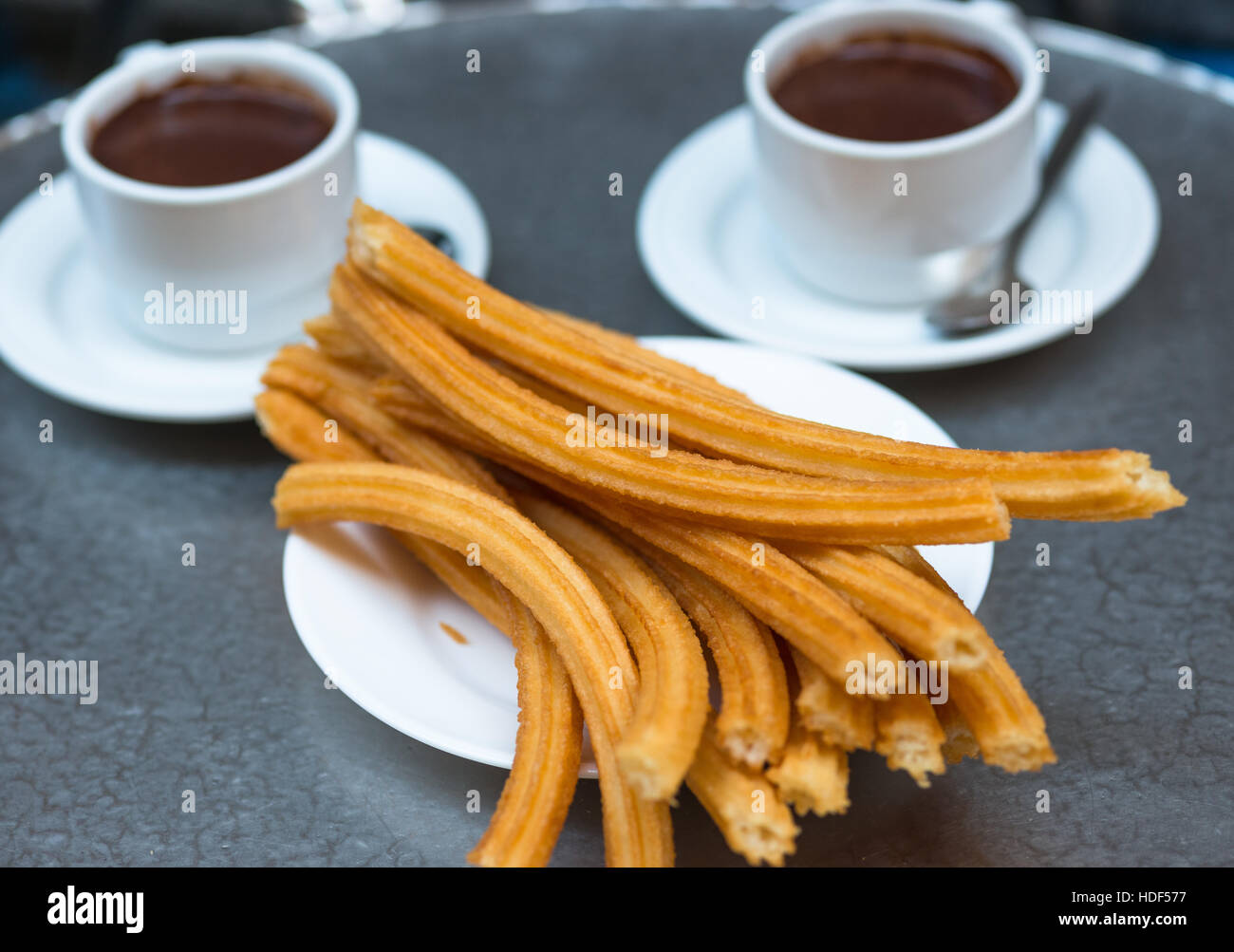Churros with chocolate, a typical Spanish sweet snack, Madrid Stock Photo