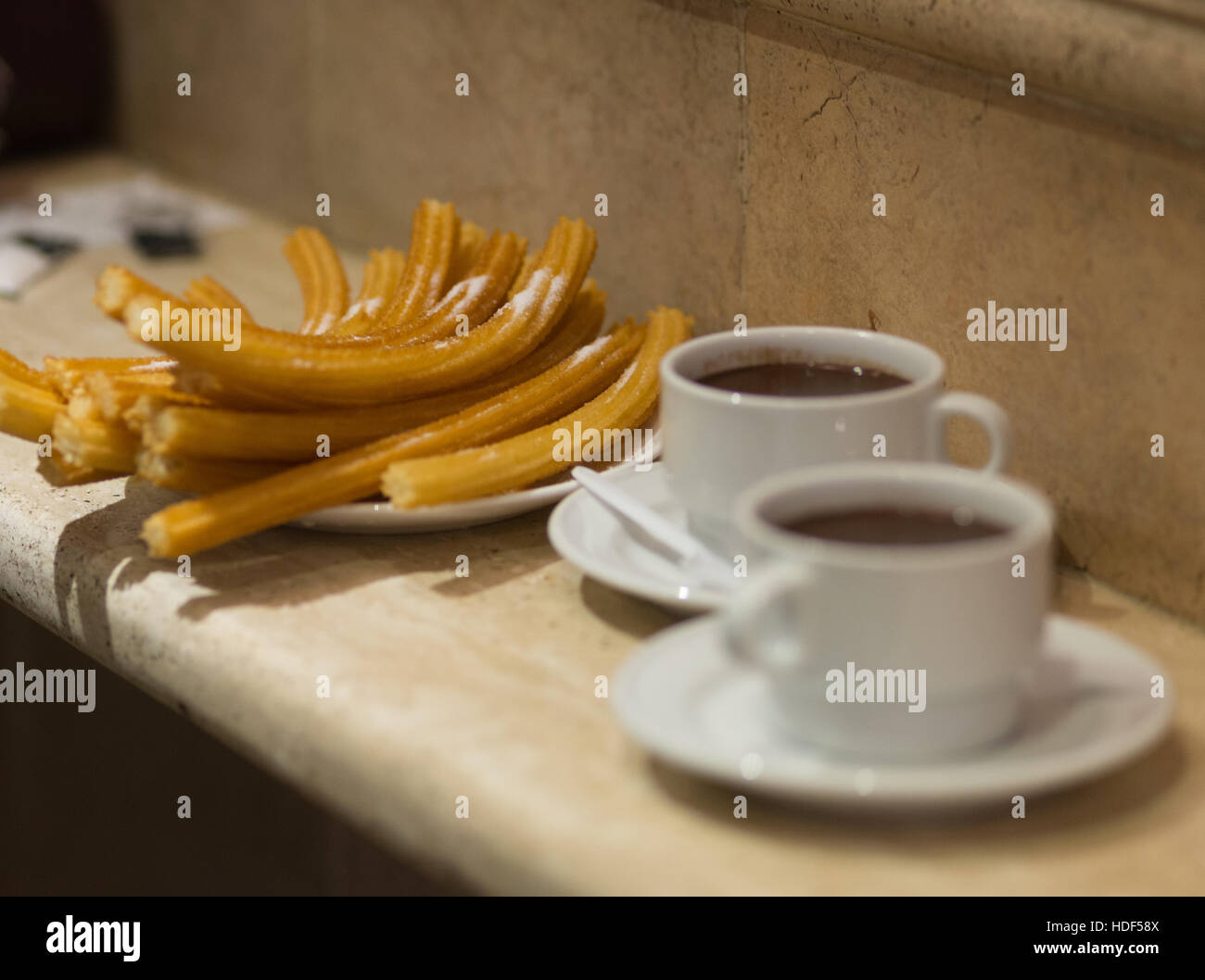 Churros with chocolate, a typical Spanish sweet snack Stock Photo